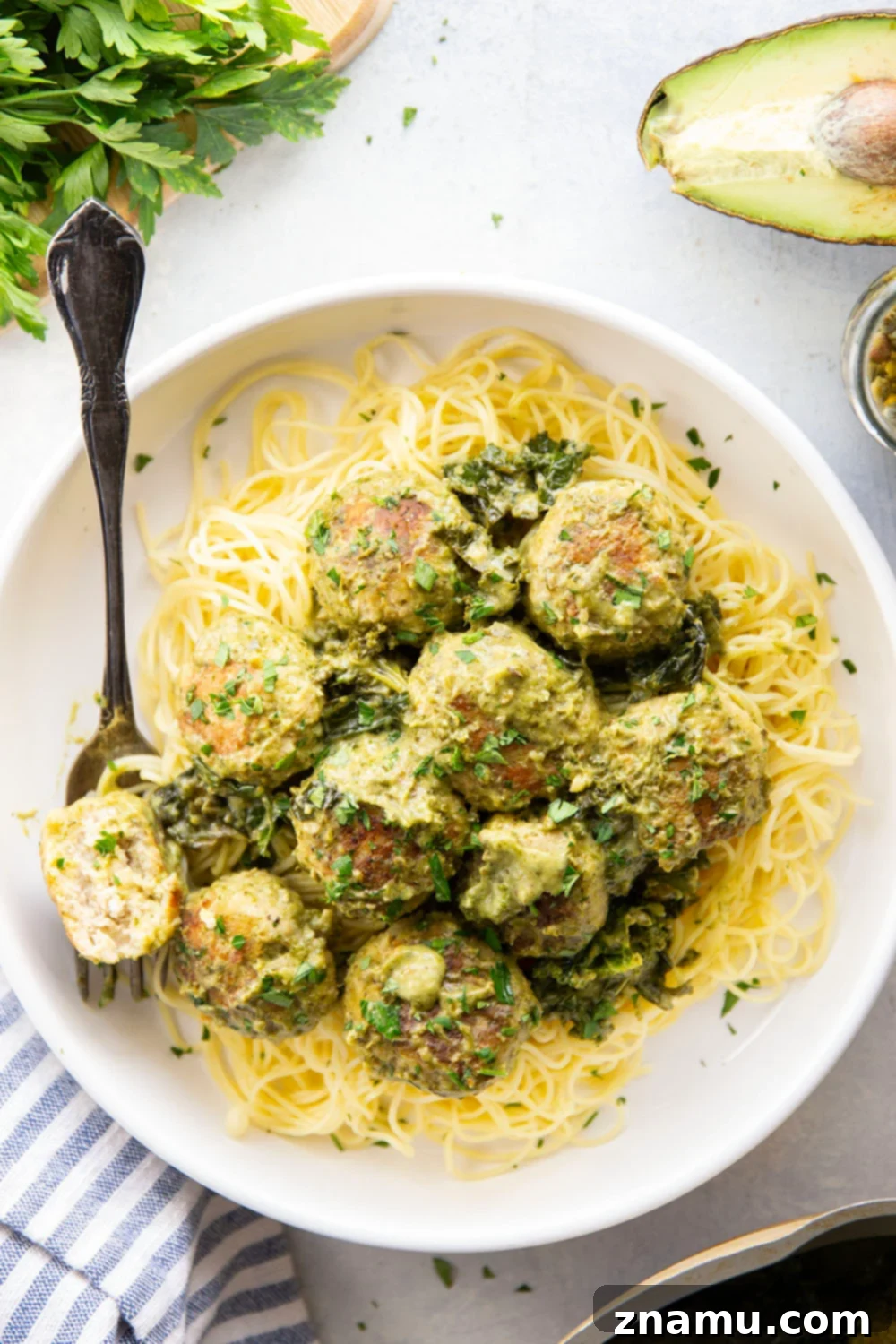 Creamy Green Goddess Chicken Meatballs 6 Green goddess chicken meatballs in a pan, ready to serve.