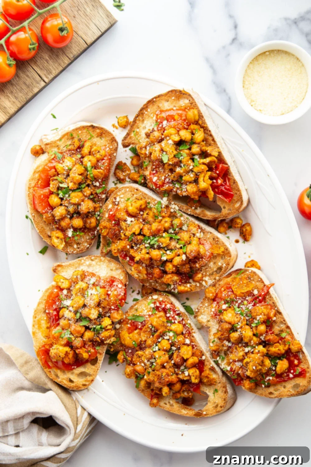 Crispy smashed chickpeas and a simple sweet cherry tomato compote are the perfect pairing in this smashed chickpea toast! Serve it for lunch or mini-sized for an appetizer.