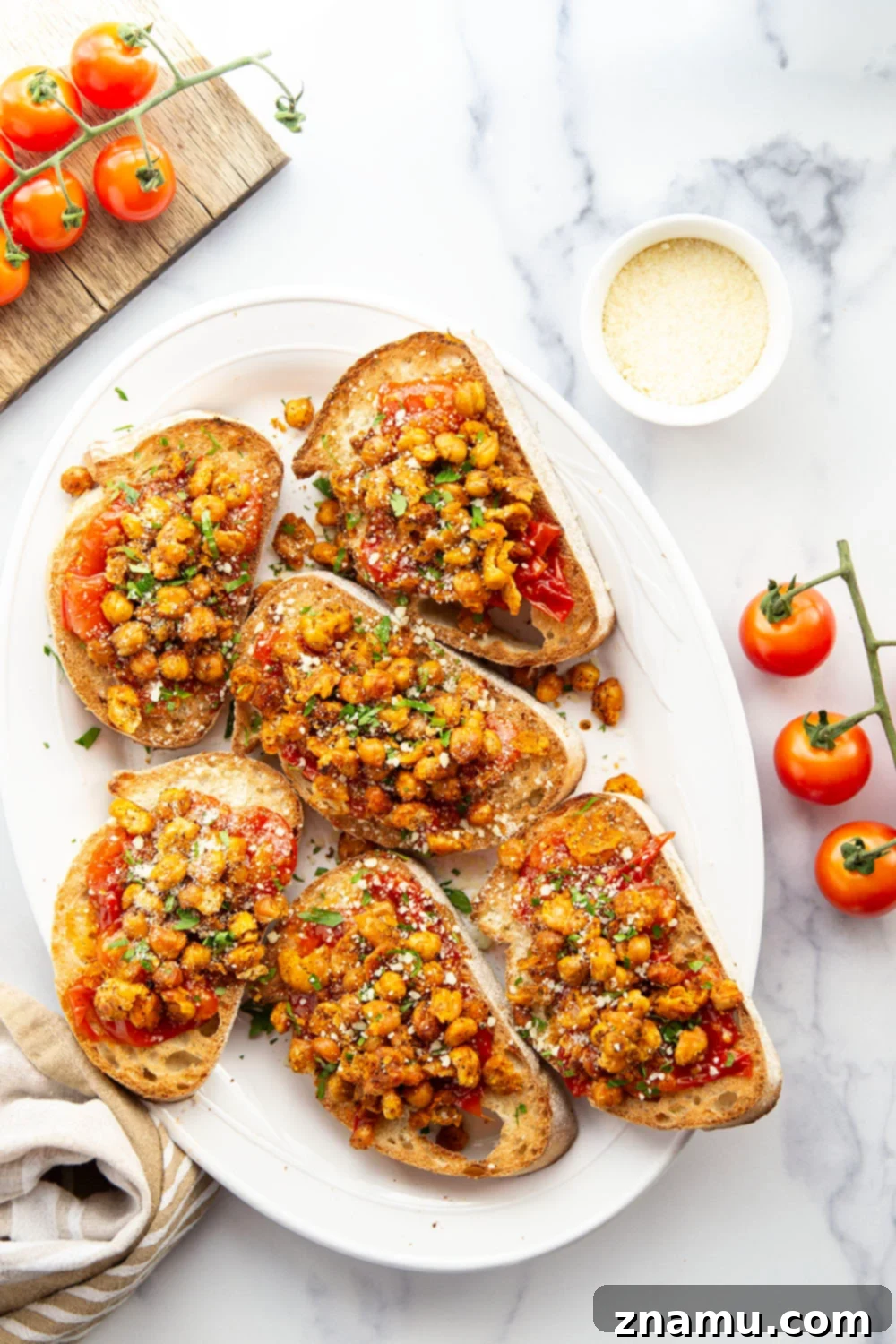 Crispy smashed chickpeas and a simple sweet cherry tomato compote are the perfect pairing in this smashed chickpea toast! Serve it for lunch or mini-sized for an appetizer.