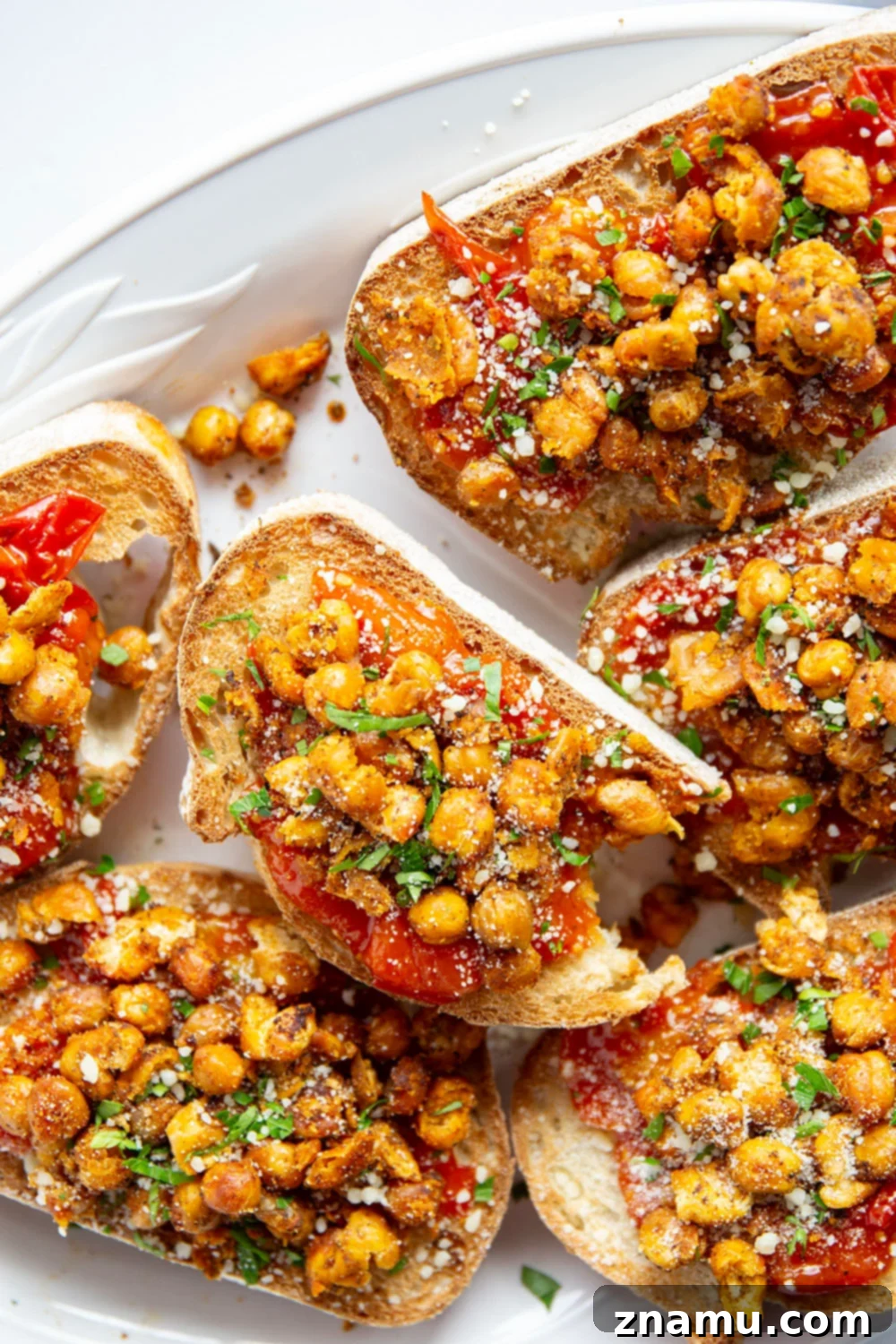 Crispy smashed chickpeas and a simple sweet cherry tomato compote are the perfect pairing in this smashed chickpea toast! Serve it for lunch or mini-sized for an appetizer.