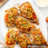 Crispy smashed chickpeas and a simple sweet cherry tomato compote are the perfect pairing in this smashed chickpea toast! Serve it for lunch or mini-sized for an appetizer.
