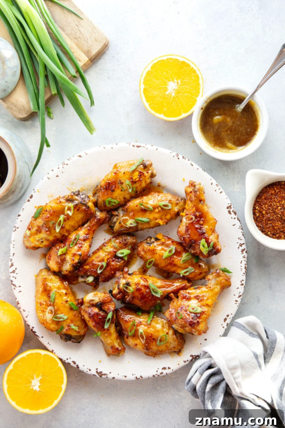Sweet Heat Orange Wings 4 Oven baked to crispy perfection and tossed in a sweet and spicy orange hot honey sauce, these hot honey chicken wings are the ultimate game day appetizer!