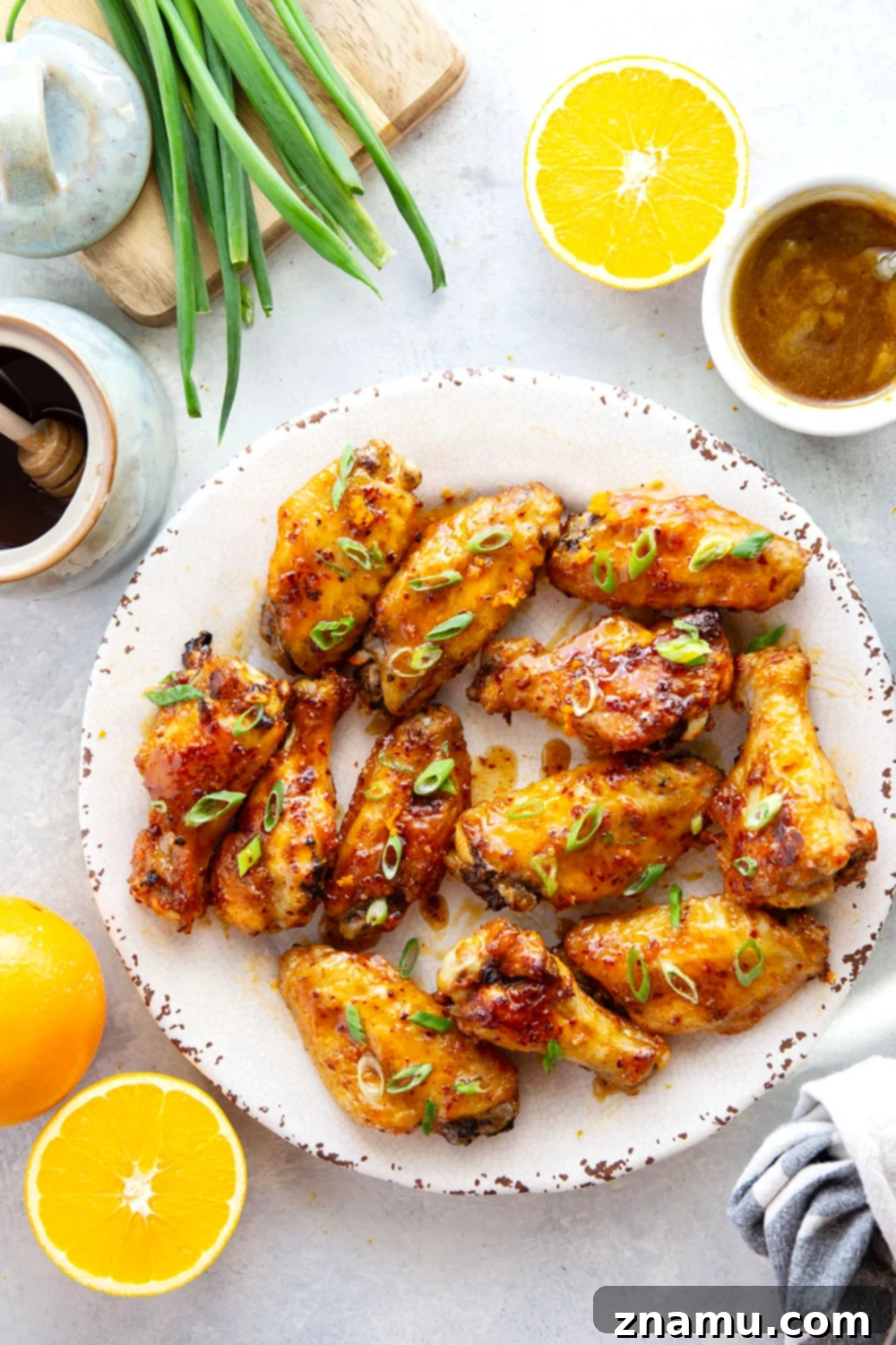 Sweet Heat Orange Wings 6 Oven baked to crispy perfection and tossed in a sweet and spicy orange hot honey sauce, these hot honey chicken wings are the ultimate game day appetizer!
