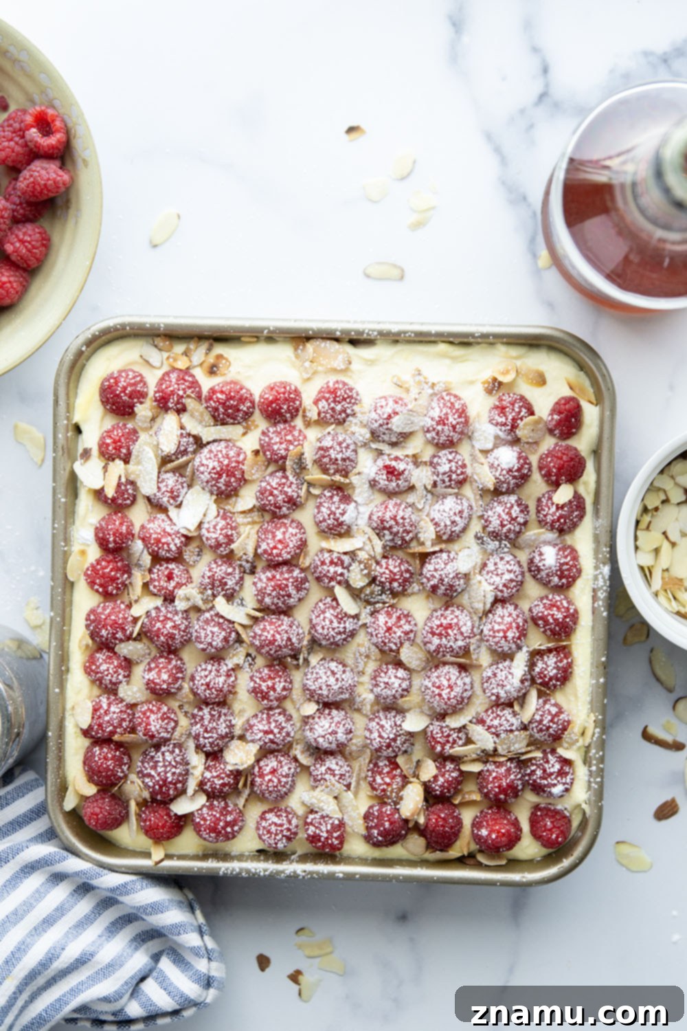 Velvet Amaretto Raspberry Tiramisu 3 This amaretto raspberry tiramisu features layers of coffee and amaretto-soaked ladyfingers, a tangy raspberry sauce, and mounds of fluffy mascarpone cream. A delightful fruity twist on the classic!