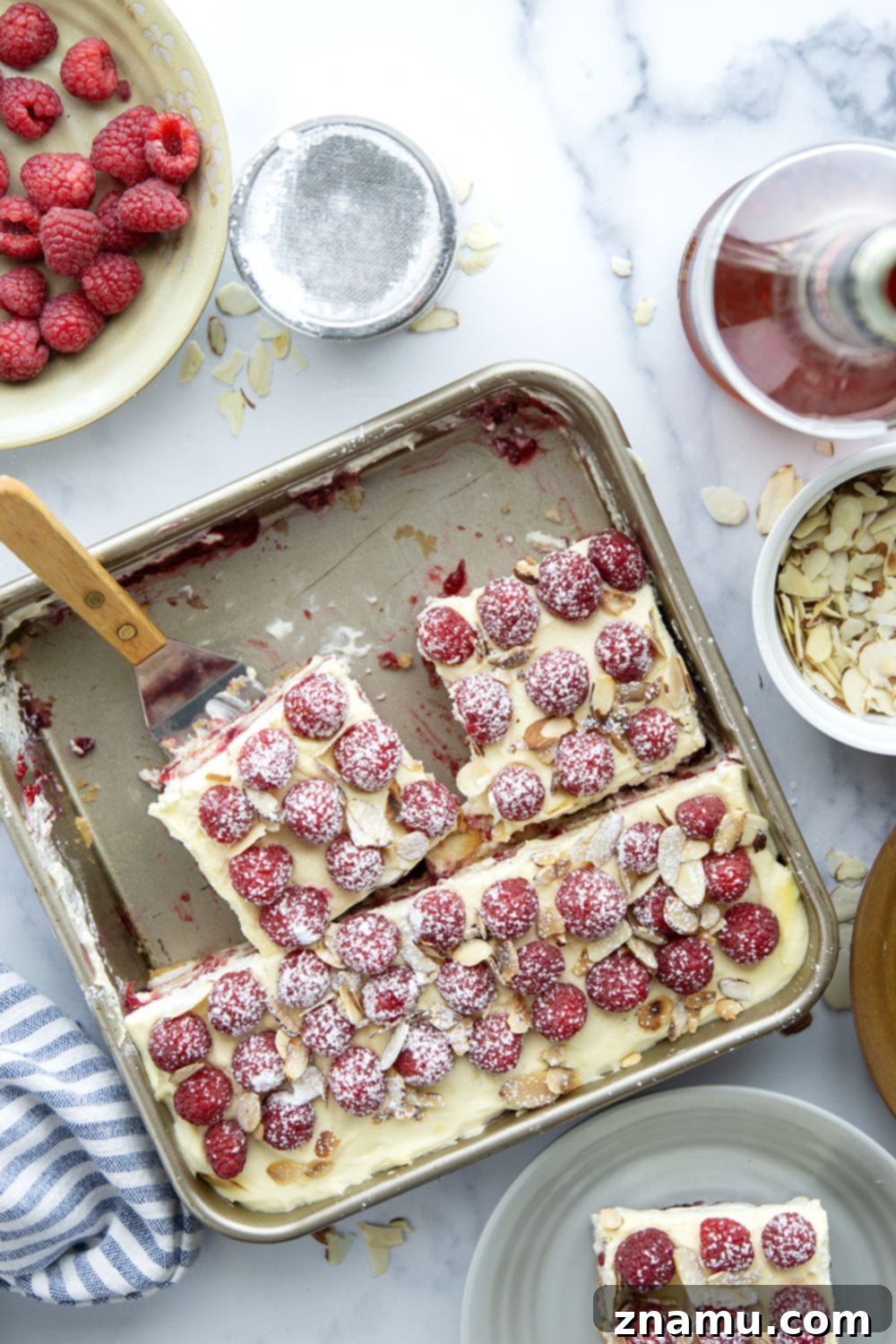 Velvet Amaretto Raspberry Tiramisu 4 This amaretto raspberry tiramisu features layers of coffee and amaretto-soaked ladyfingers, a tangy raspberry sauce, and mounds of fluffy mascarpone cream. A delightful fruity twist on the classic!