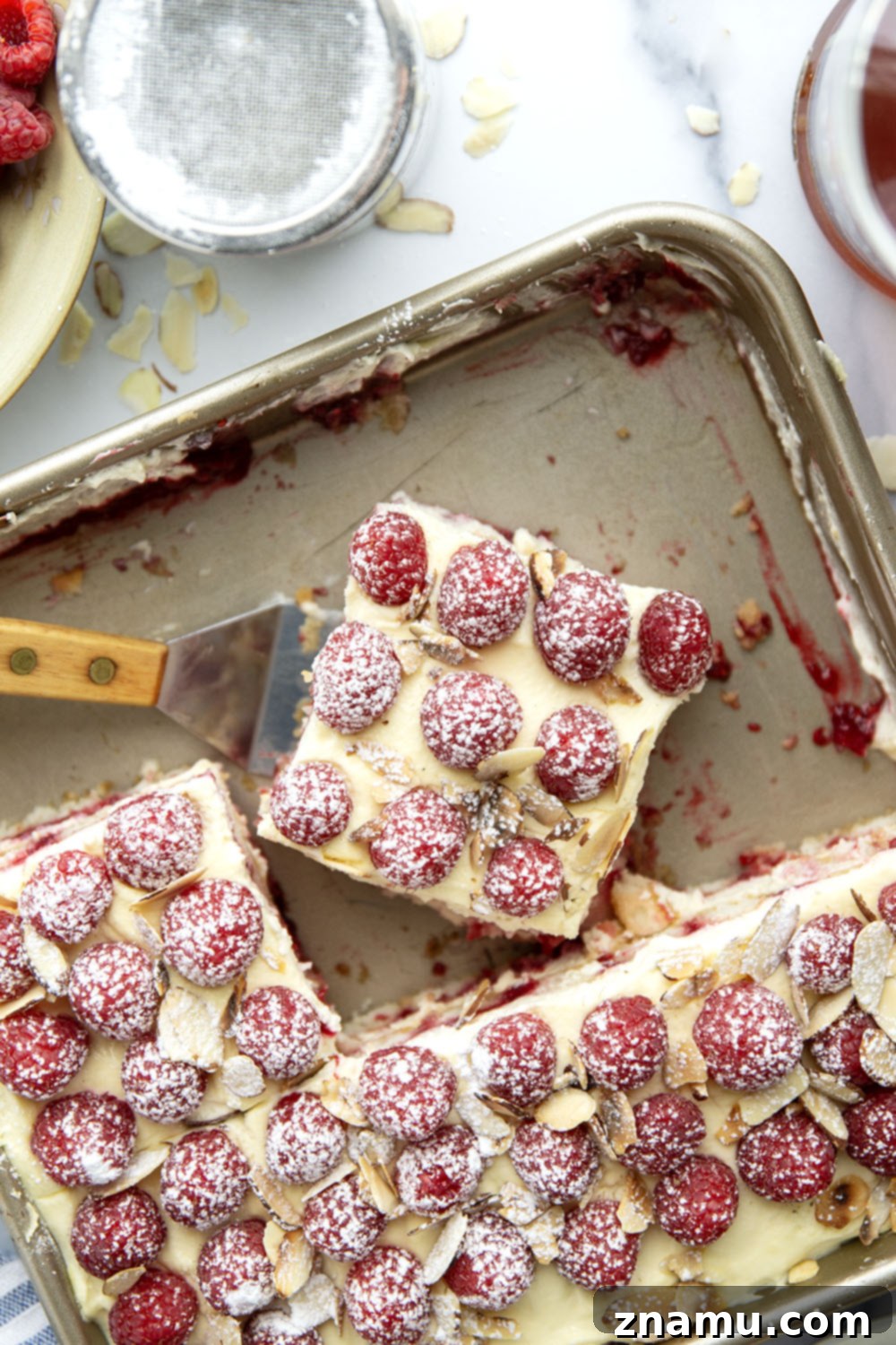 Velvet Amaretto Raspberry Tiramisu 6 This amaretto raspberry tiramisu features layers of coffee and amaretto-soaked ladyfingers, a tangy raspberry sauce, and mounds of fluffy mascarpone cream. A delightful fruity twist on the classic!