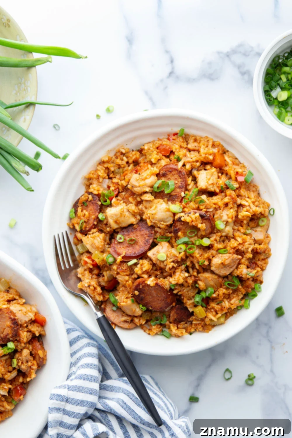 Effortless Cajun Instant Pot Jambalaya 6 A serving of Instant Pot Jambalaya in a bowl, showing the rich texture and vibrant colors of the ingredients.