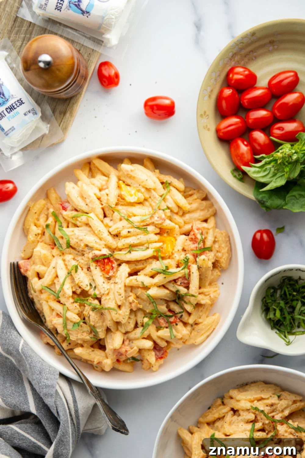 Mediterranean Goat Cheese Tomato Pasta 4 Juicy cherry tomatoes, creamy goat cheese, and lots of fresh basil dress up this easy goat cheese pasta that's ready in only 30 minutes.