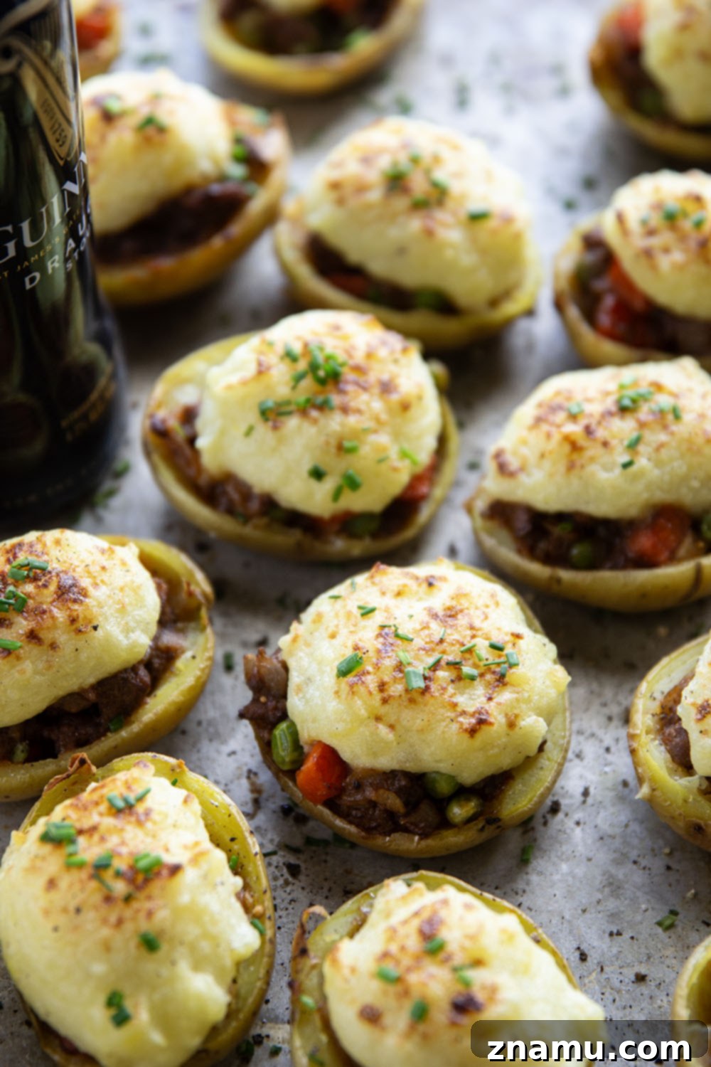 Guinness Shepherd's Pie Loaded Potato Skins 2 Guinness Shepherd's Pie Potato Skins: Crispy potato skins filled with a rich Guinness-infused beef and vegetable mixture, topped with creamy mashed potatoes, perfect for St. Patrick's Day.