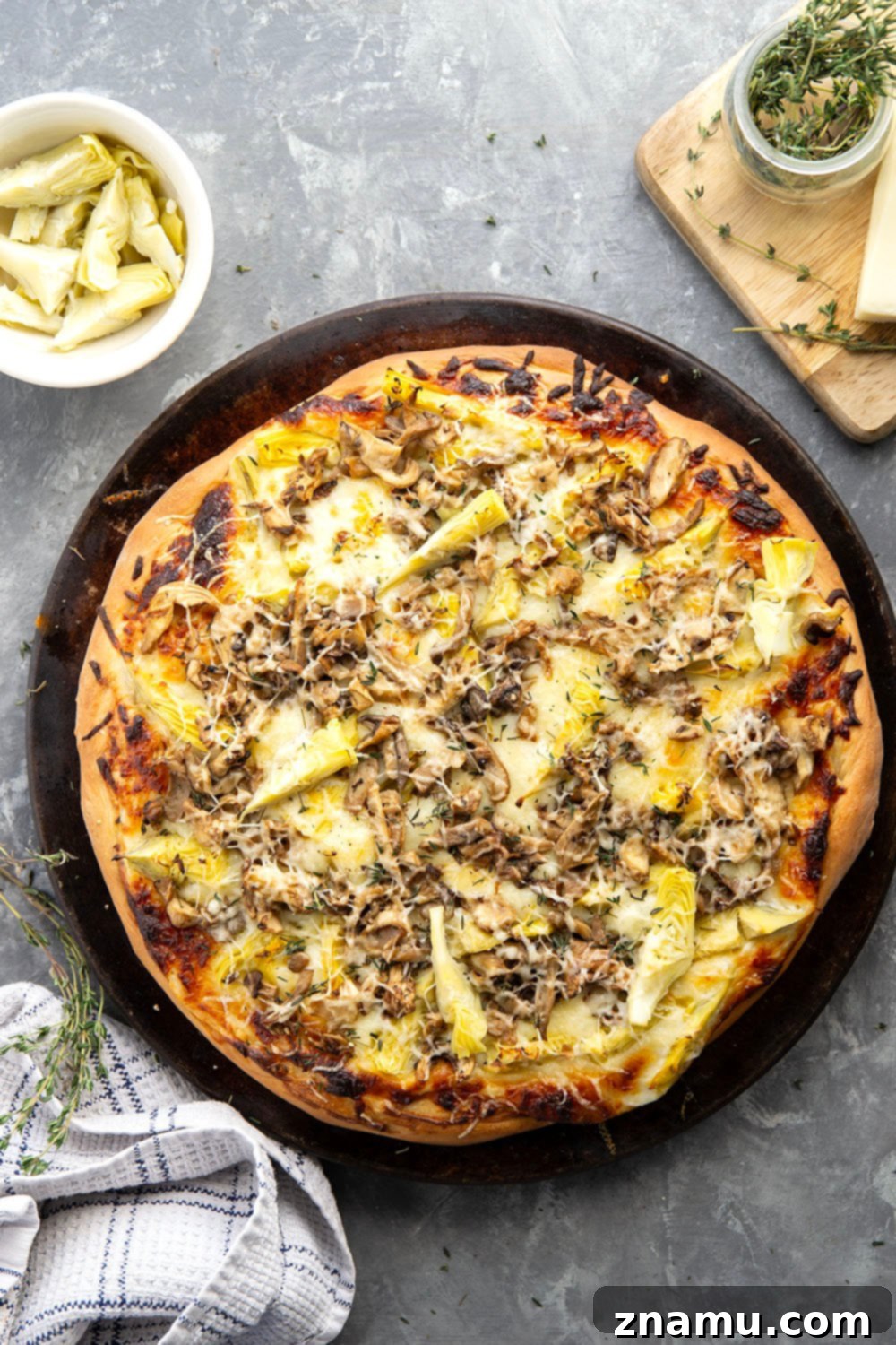 Gourmet Asiago Shiitake Mushroom Artichoke Pizza 2 This mushroom artichoke pizza features a creamy asiago alfredo sauce, buttery sauteed shiitake mushrooms, and lots of tender artichoke hearts.