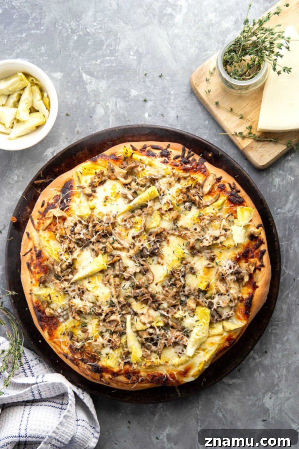 Gourmet Asiago Shiitake Mushroom Artichoke Pizza 4 This mushroom artichoke pizza features a creamy asiago alfredo sauce, buttery sauteed shiitake mushrooms, and lots of tender artichoke hearts.