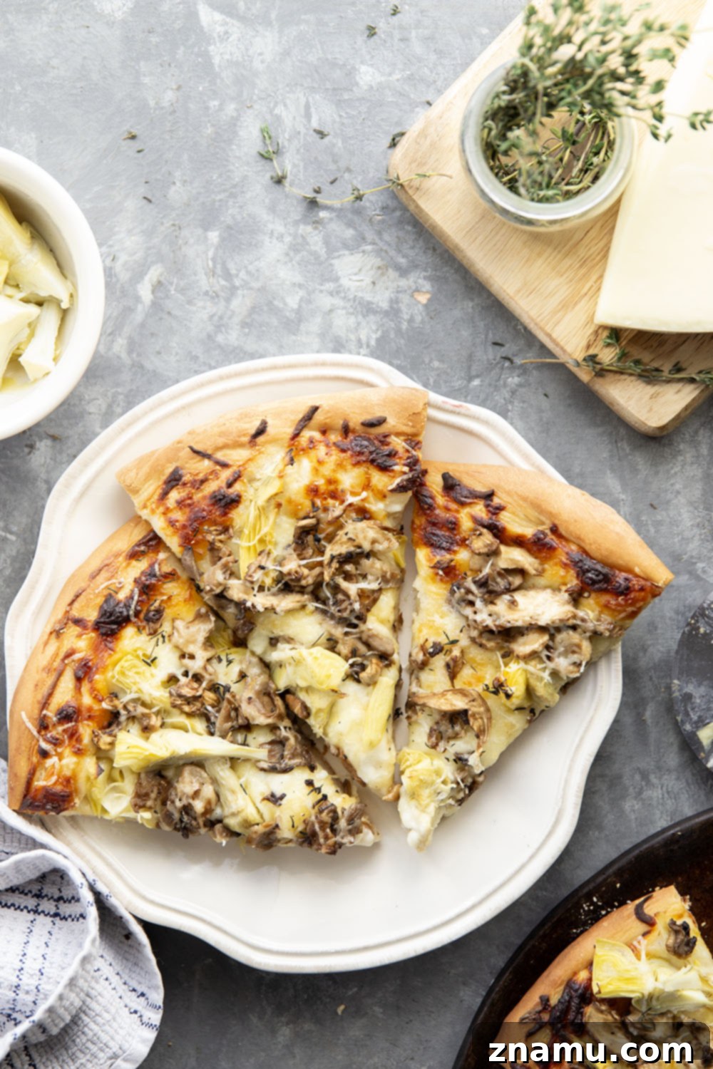 Gourmet Asiago Shiitake Mushroom Artichoke Pizza 5 This mushroom artichoke pizza features a creamy asiago alfredo sauce, buttery sauteed shiitake mushrooms, and lots of tender artichoke hearts.