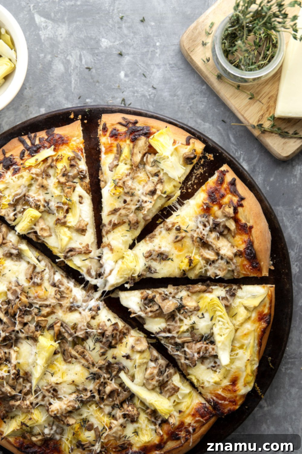 Gourmet Asiago Shiitake Mushroom Artichoke Pizza 6 This mushroom artichoke pizza features a creamy asiago alfredo sauce, buttery sauteed shiitake mushrooms, and lots of tender artichoke hearts.