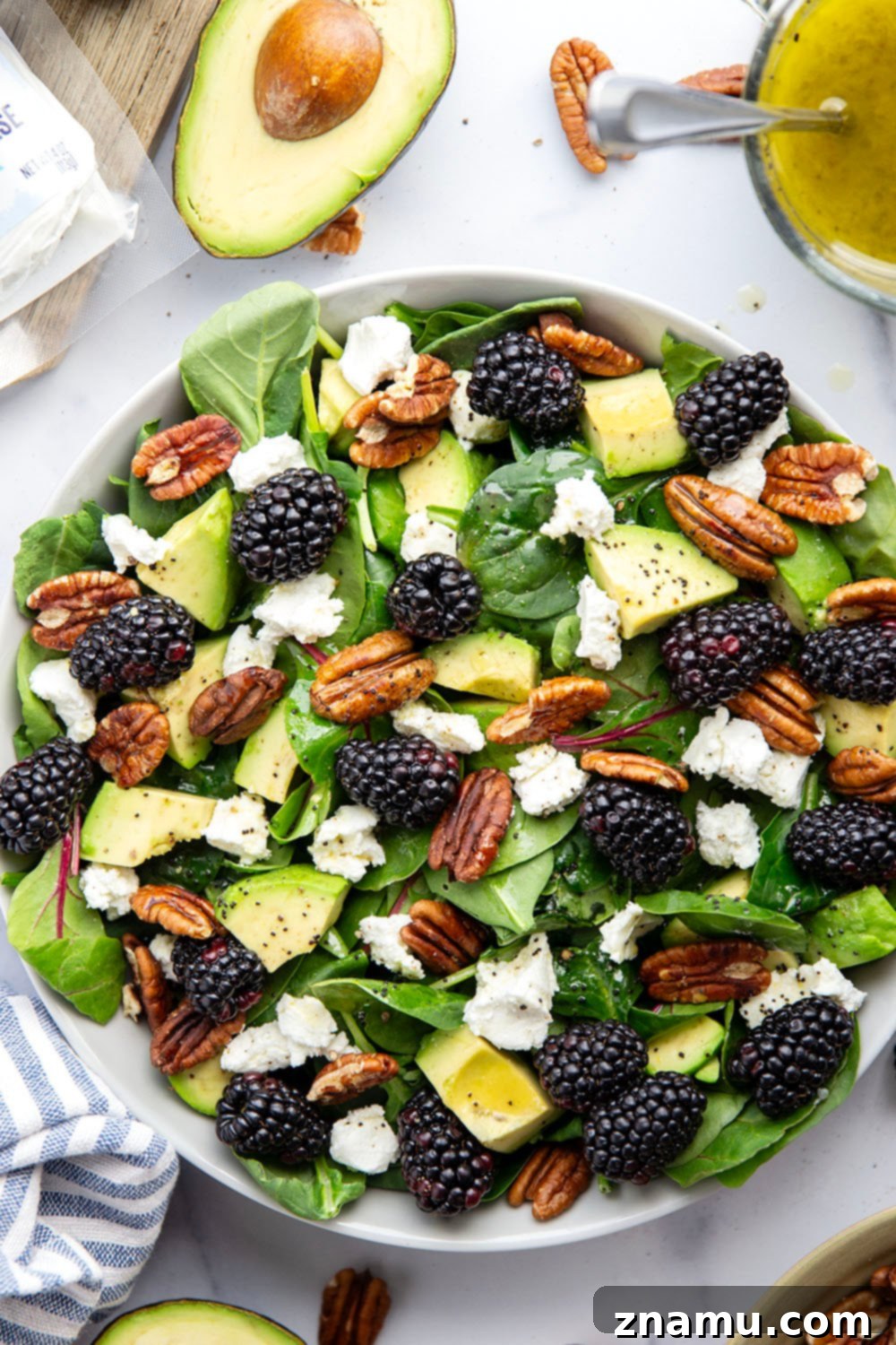 Blackberry Chèvre Salad with Zesty Citrus Poppyseed Vinaigrette 3 Close-up of fresh blackberries and goat cheese in a spring salad