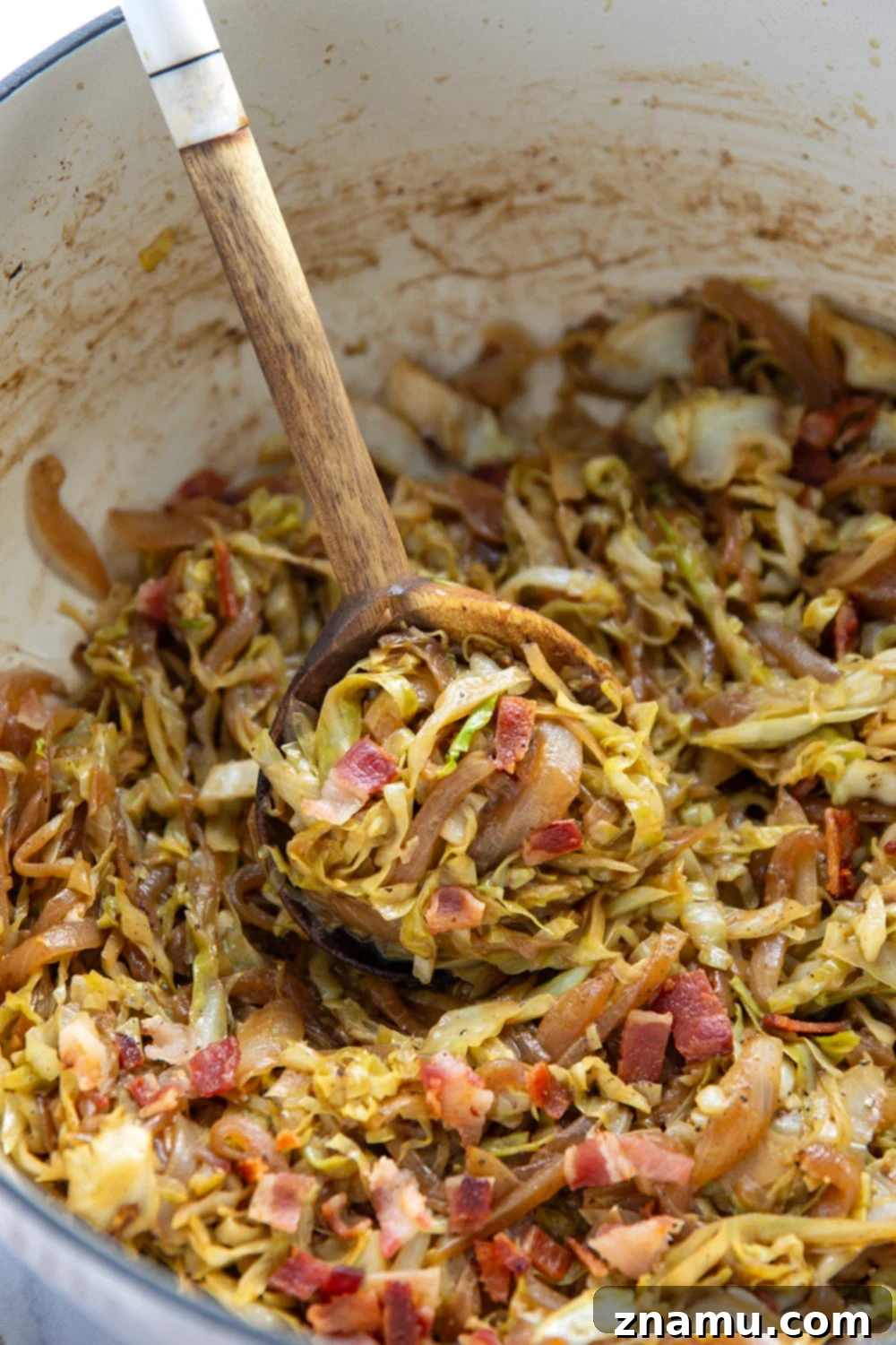 Sweet and Savory Bacon Cabbage Skillet 3 Deeply flavorful caramelized onion and crispy bacon pair perfectly with tender cabbage in this easy bacon fried cabbage. Try pairing it with corned beef and potatoes for a full hearty meal.