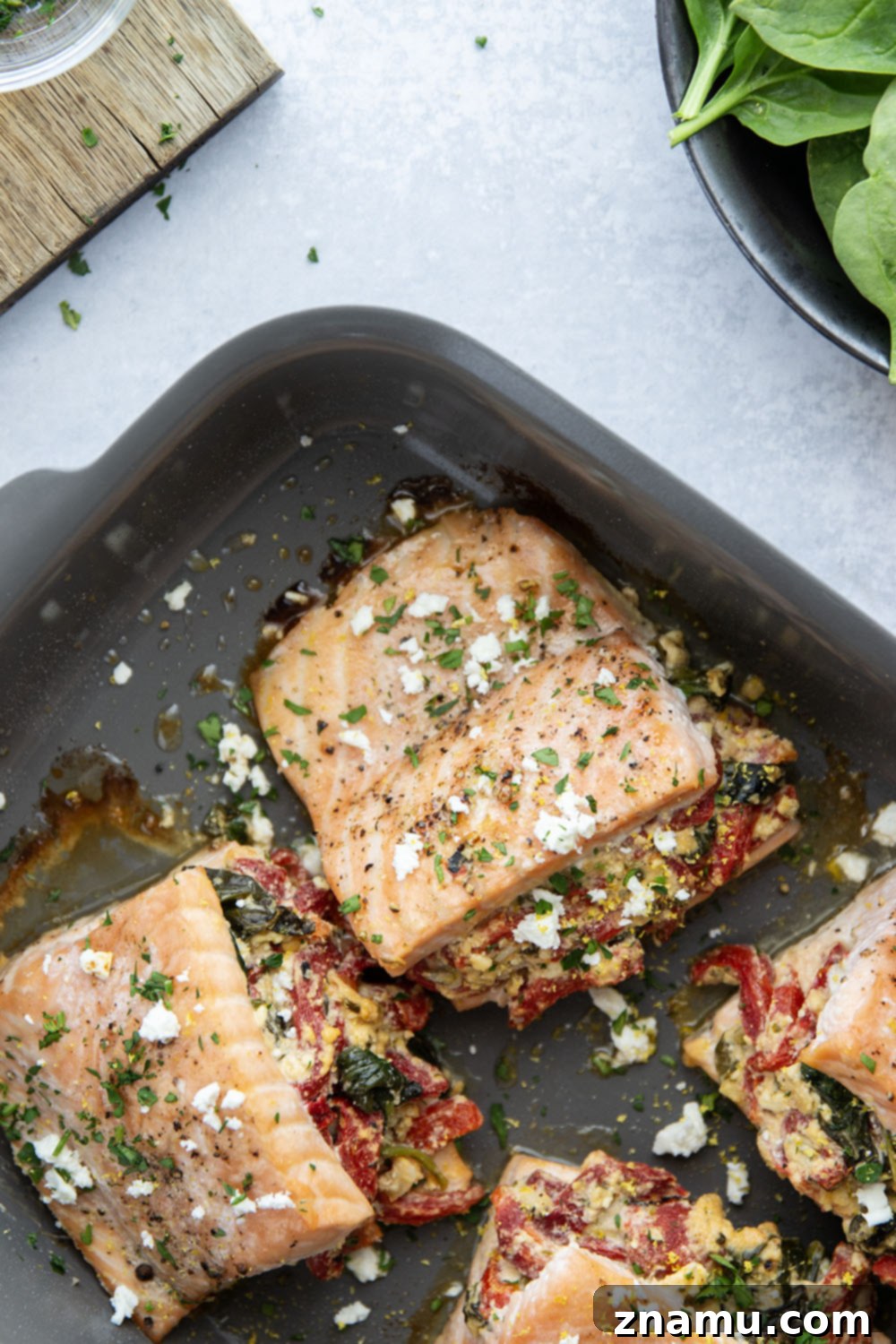 Feta and Roasted Red Pepper Stuffed Salmon 6 Plated Feta Stuffed Salmon, ready to be served with delicious sides.