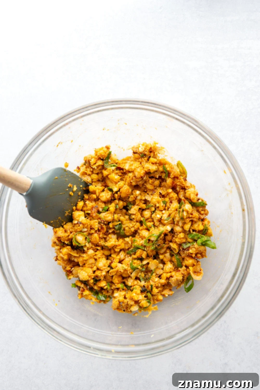 Golden Smashed Chickpea Tacos 3 These crispy chickpea tacos feature a smashed chickpea filling with two kinds of gooey cheese melted inside and lots of spicy chili crisp.