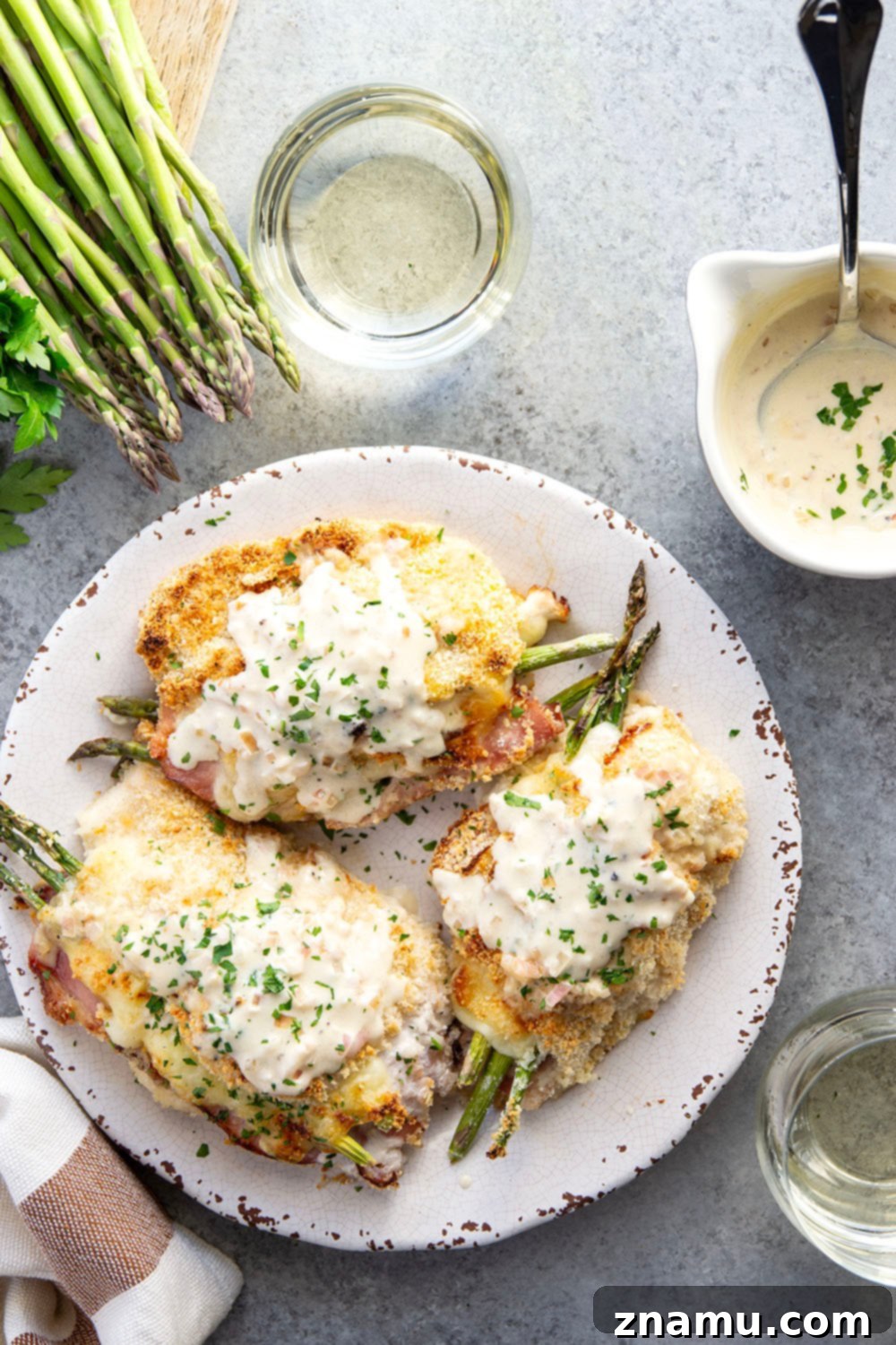 Verdant Cordon Bleu Chicken 6 Plated Asparagus Stuffed Chicken Cordon Bleu with Cream Sauce