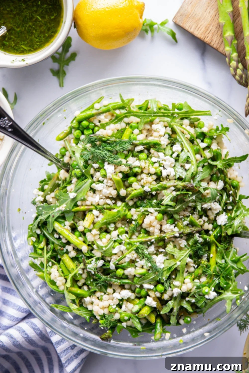 Spring Asparagus Couscous Salad with Zesty Dill Vinaigrette 2 A vibrant Asparagus Couscous Salad with tender pearl couscous, fresh asparagus, and peas, drizzled with a homemade dill vinaigrette. Ideal for spring gatherings or a healthy lunch.
