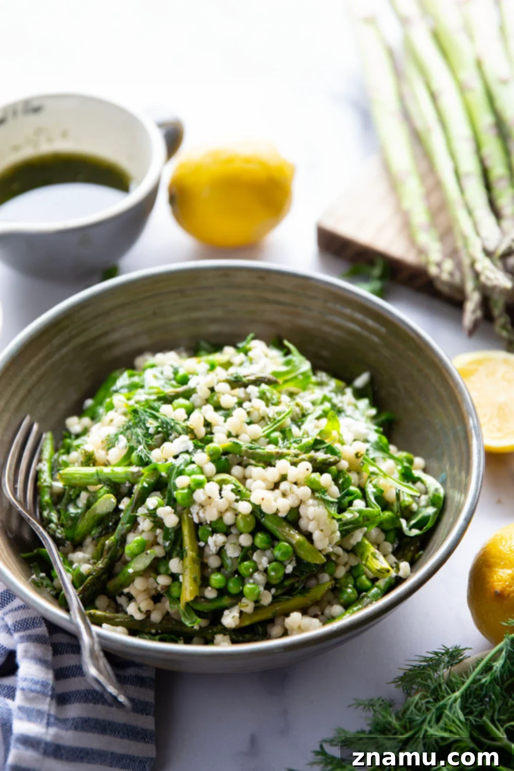 Spring Asparagus Couscous Salad with Zesty Dill Vinaigrette 5 Freshly cooked pearl couscous, light and fluffy, ready to be incorporated into the asparagus couscous salad.
