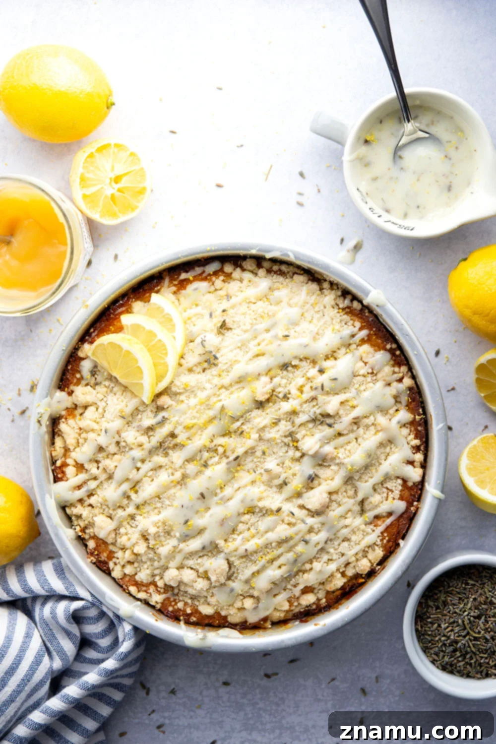 Morning Lavender Lemon Cake 3 A slice of moist Lavender Lemon Coffee Cake with visible lemon curd swirls and streusel topping, showcasing the perfect texture.