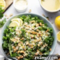 A fresh lemon tahini dressing coats every inch of this asiago lemon cashew kale salad that's easy to whip up and always the most popular salad on the table.