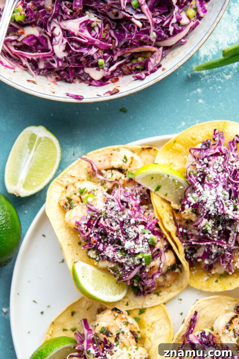 Sizzling Cilantro Lime Shrimp Tacos with Smoky Chipotle Slaw 4 Freshly peeled and deveined shrimp ready for marinating in cilantro lime sauce, essential for flavorful grilled shrimp tacos.