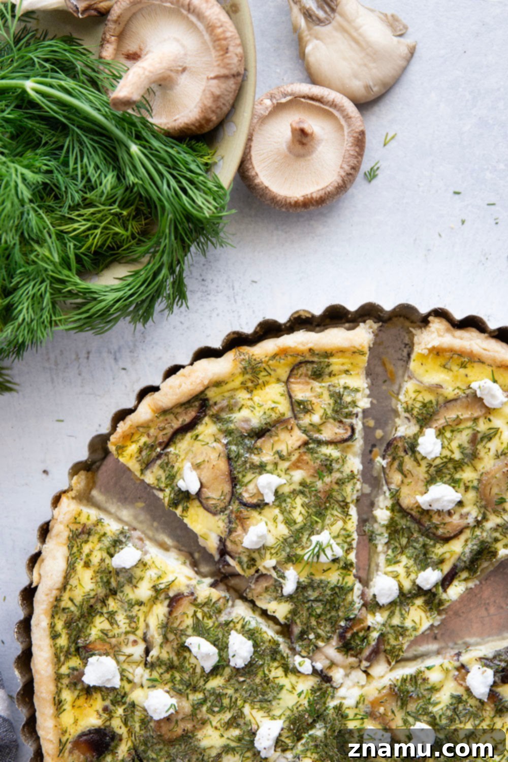 Rustic Wild Mushroom Goat Cheese Quiche 4 A beautifully baked Wild Mushroom Goat Cheese Quiche, ready to be sliced and served.
