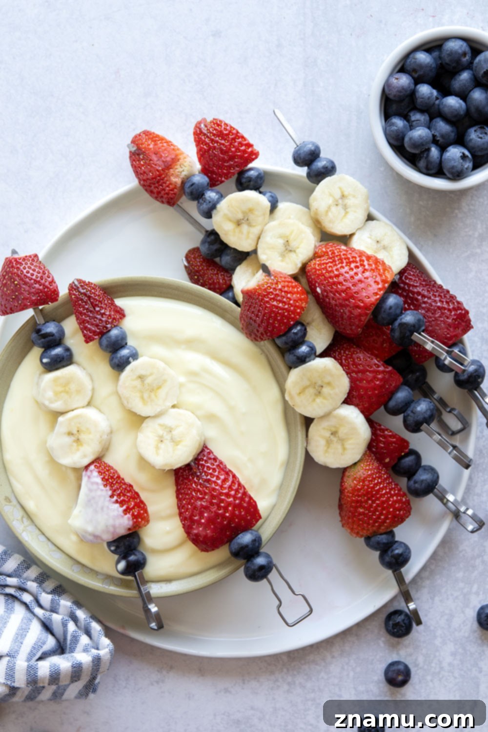 Patriotic Fruit Skewers with Creamy Vanilla Dip 4 A closer view of the creamy Vanilla Pudding Dip beside freshly prepared fruit skewers.