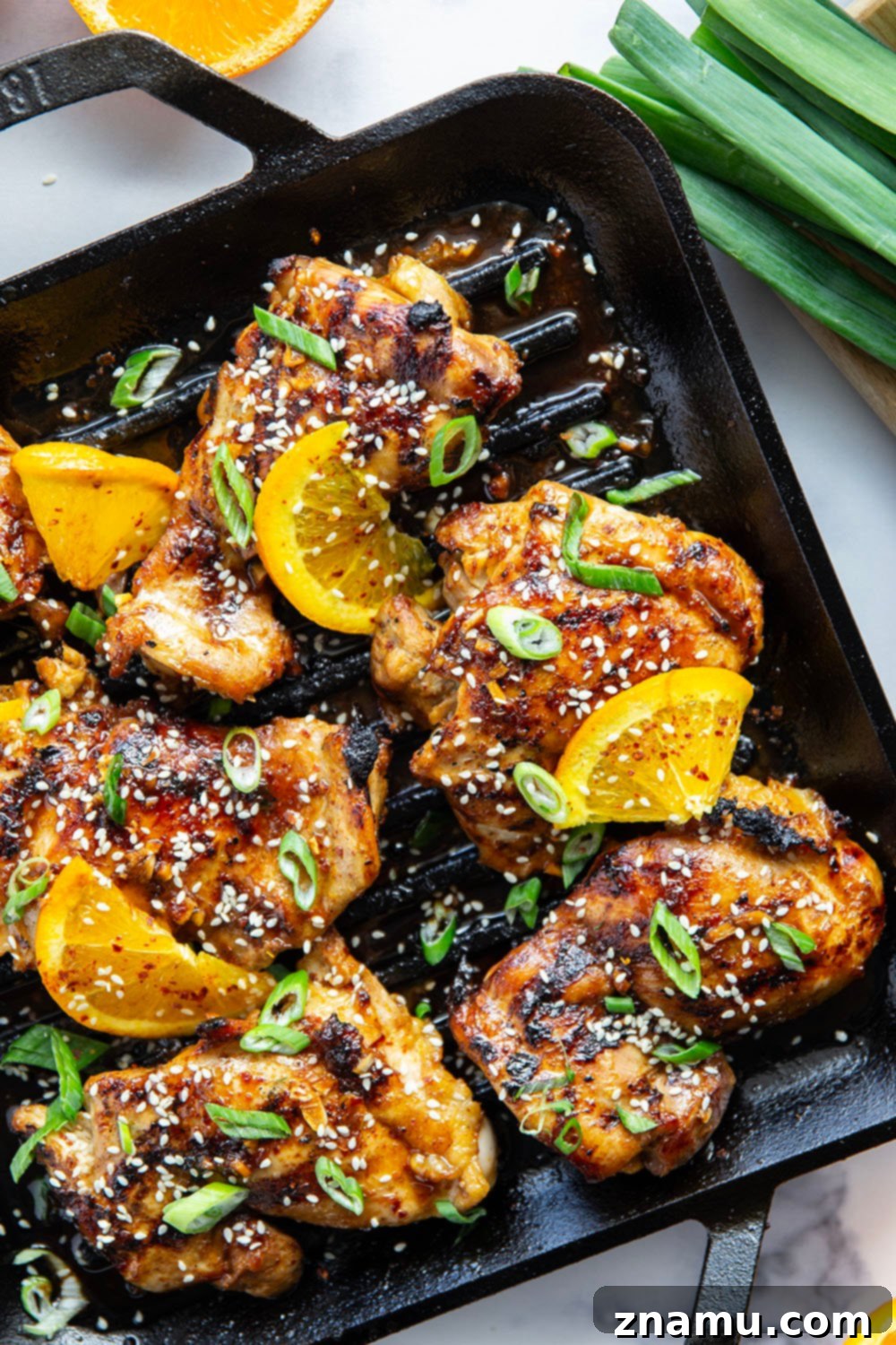 Fiery Orange Glazed Chicken 4 Marinated in a spicy fresh orange sauce and grilled to smoky perfection, this orange marinated chicken will quickly become a cookout favorite.