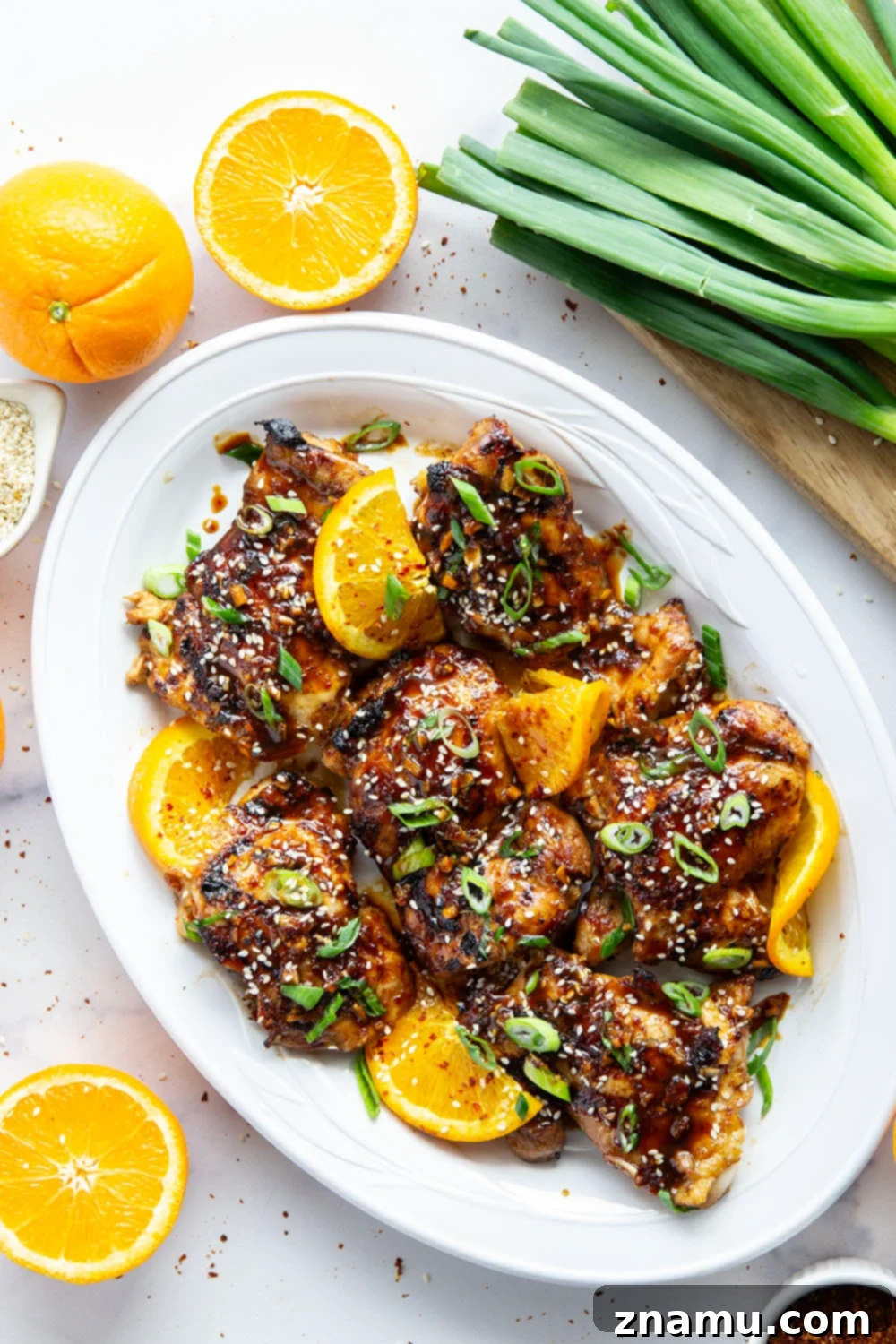 Fiery Orange Glazed Chicken 5 Marinated in a spicy fresh orange sauce and grilled to smoky perfection, this orange marinated chicken will quickly become a cookout favorite.