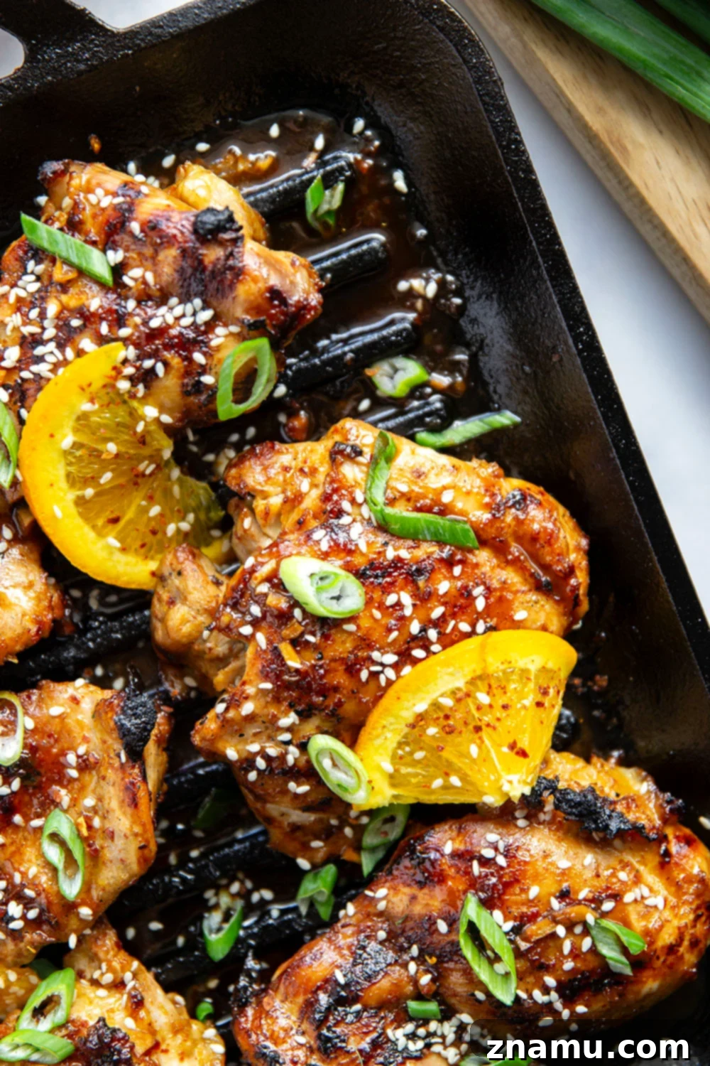 Fiery Orange Glazed Chicken 6 Marinated in a spicy fresh orange sauce and grilled to smoky perfection, this orange marinated chicken will quickly become a cookout favorite.