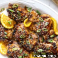 Fiery Orange Glazed Chicken 8 Marinated in a spicy fresh orange sauce and grilled to smoky perfection, this orange marinated chicken will quickly become a cookout favorite.