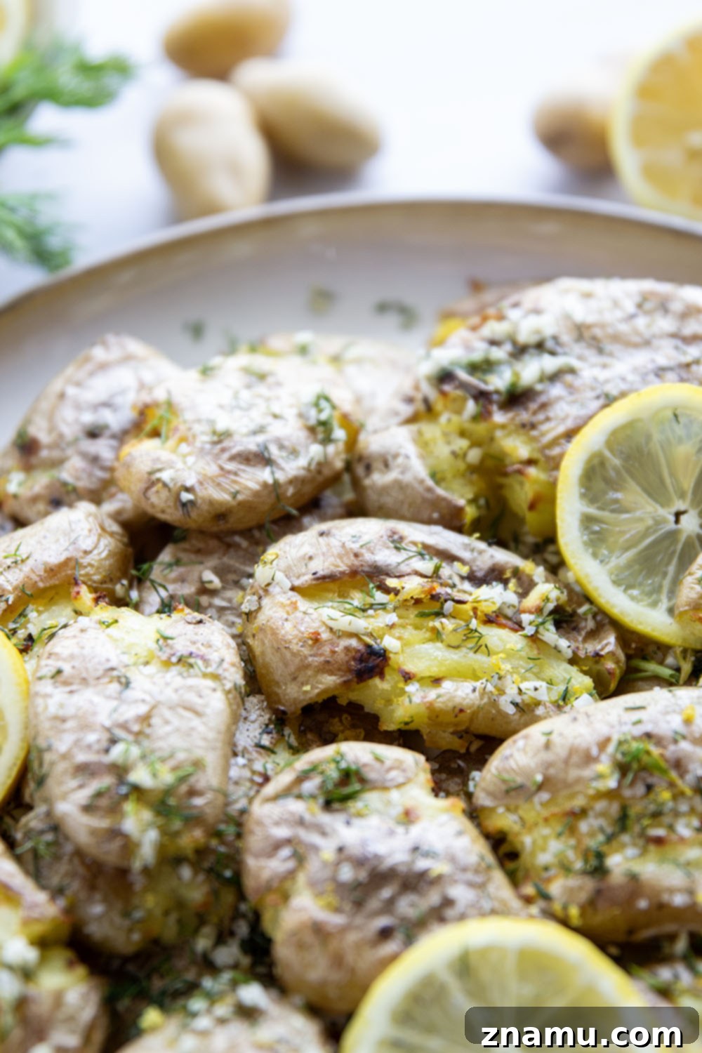 Crispy Lemon Dill Smashed Potatoes 4 These smashed fingerling potatoes feature roasted fingerling potatoes smashed and broiled until crispy and then drizzled with a fresh lemon dill sauce.