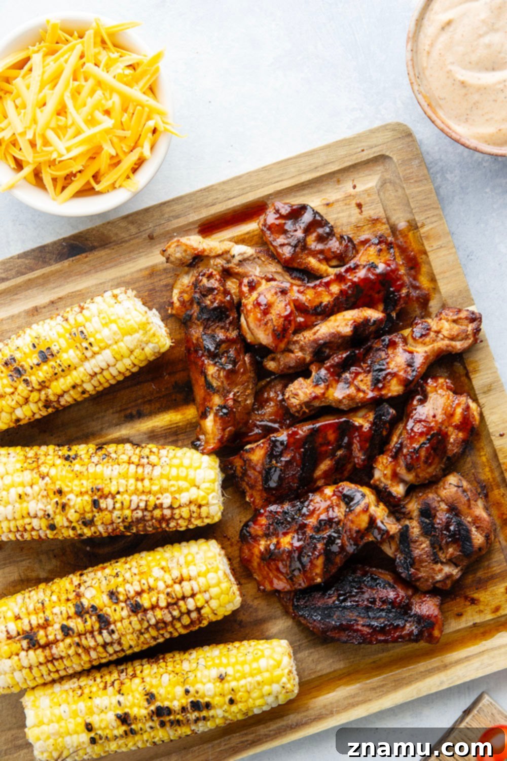 Close-up of a large serving of BBQ Chicken Chopped Salad with grilled corn kernels visible.