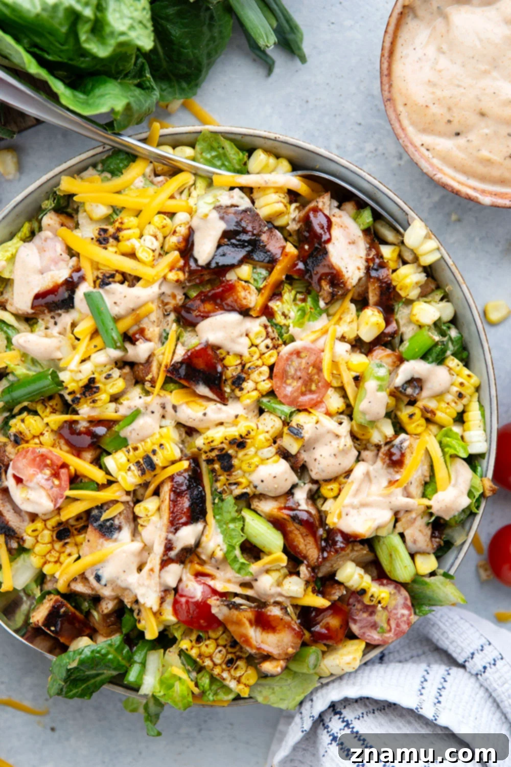 A large bowl of Grilled Sweet Corn BBQ Chicken Chopped Salad, beautifully dressed and ready to serve.