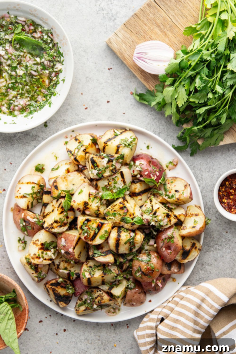 Grilled Red Potatoes with Chimichurri 2 Grilled to smoky, tender perfection and tossed in a fresh herby chimichurri sauce, these grilled chimichurri red potatoes go well with any summer meal!