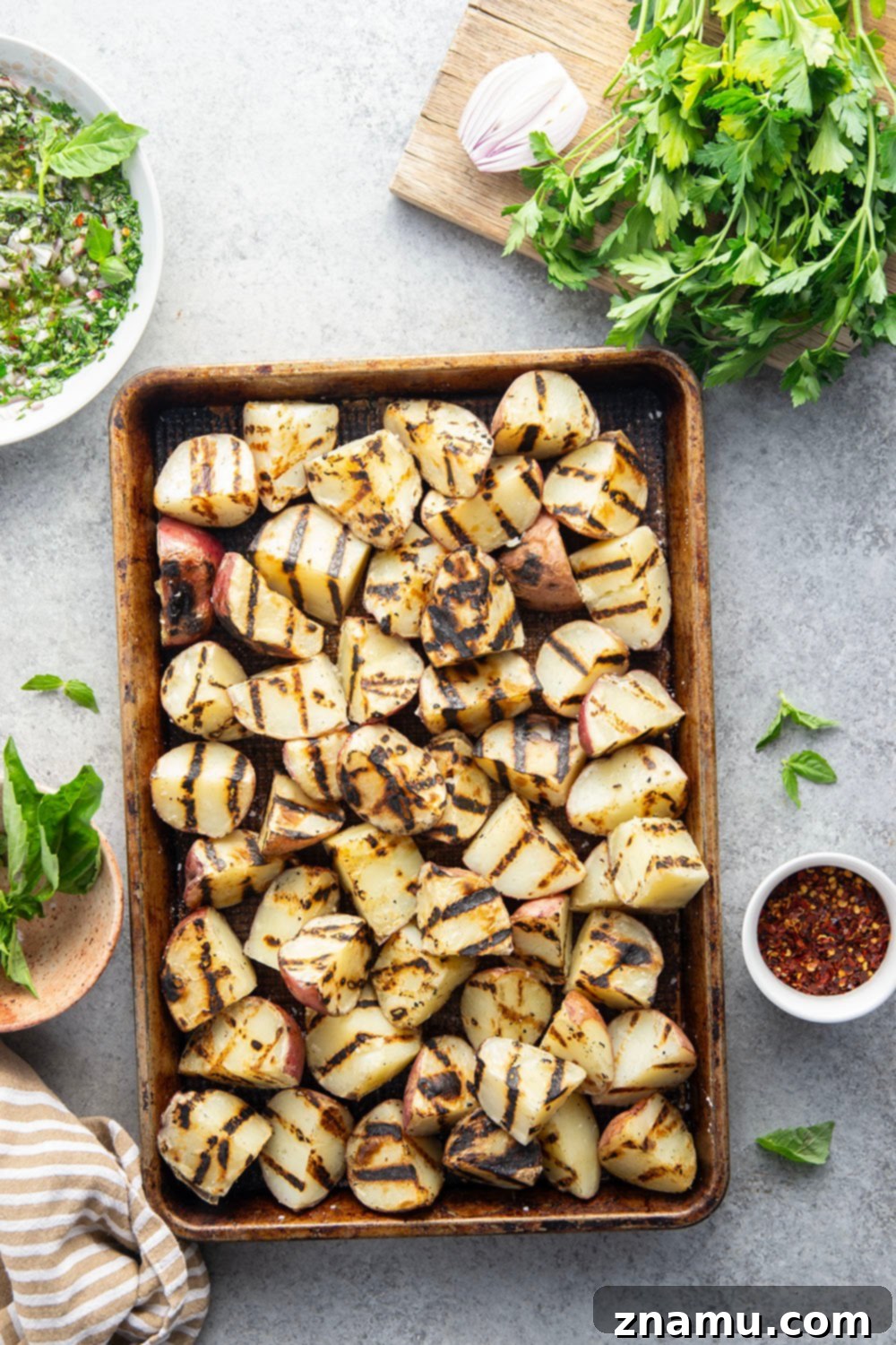 Grilled Red Potatoes with Chimichurri 3 Grilled to smoky, tender perfection and tossed in a fresh herby chimichurri sauce, these grilled chimichurri red potatoes go well with any summer meal!