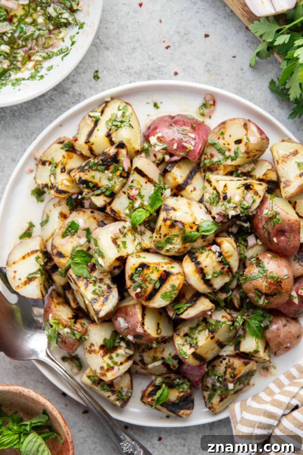 Grilled Red Potatoes with Chimichurri 5 Grilled to smoky, tender perfection and tossed in a fresh herby chimichurri sauce, these grilled chimichurri red potatoes go well with any summer meal!