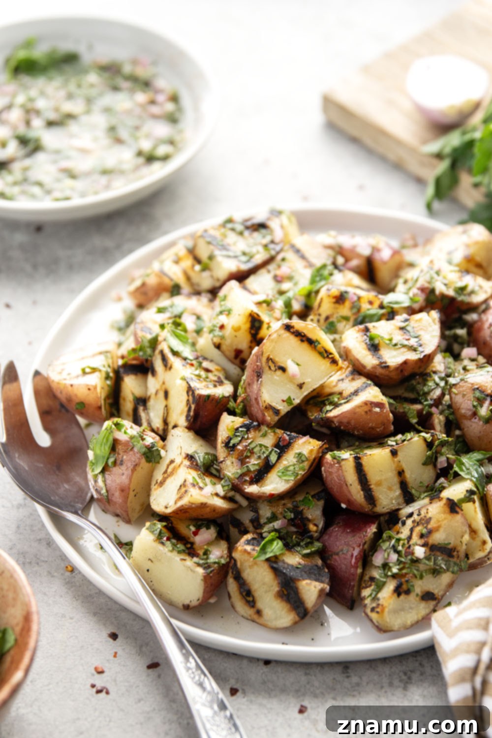 Grilled Red Potatoes with Chimichurri 6 Grilled to smoky, tender perfection and tossed in a fresh herby chimichurri sauce, these grilled chimichurri red potatoes go well with any summer meal!