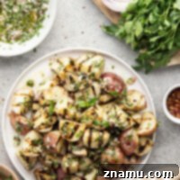Grilled Red Potatoes with Chimichurri 8 Grilled to smoky, tender perfection and tossed in a fresh herby chimichurri sauce, these grilled chimichurri red potatoes go well with any summer meal!