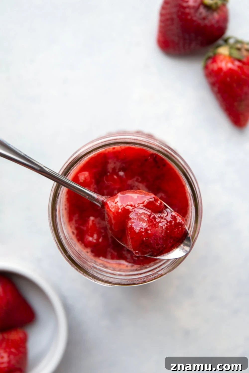 Luscious Homemade Strawberry Sauce 6 Fluffy pancakes topped with generous spoonfuls of homemade strawberry sauce.