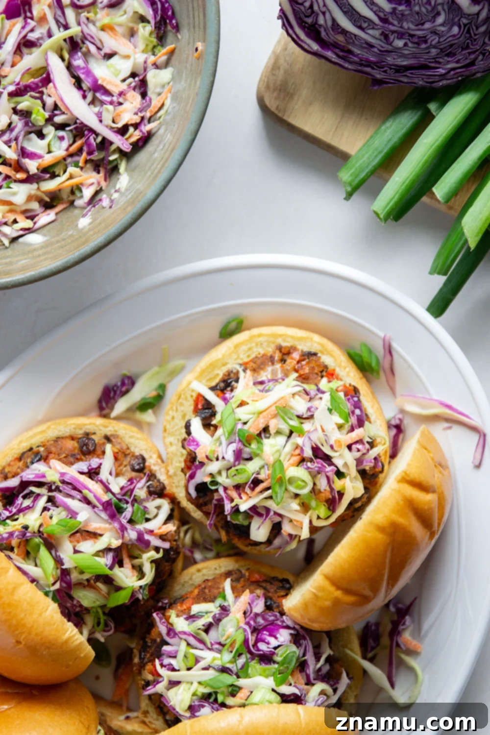Spicy Chipotle Black Bean Burgers with Tangy Buttermilk Slaw 4 Smoky chipotle black bean burgers are packed full of spicy flavors and incredible in a warm toasted bun with lots of creamy buttermilk slaw piled on top.