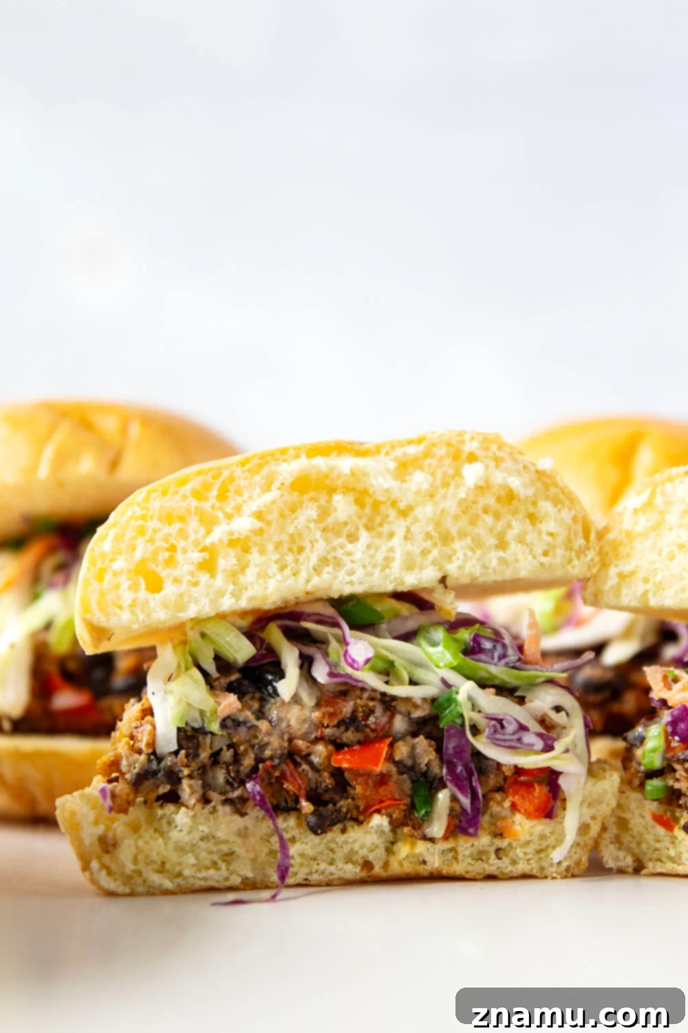 Spicy Chipotle Black Bean Burgers with Tangy Buttermilk Slaw 5 Smoky chipotle black bean burgers are packed full of spicy flavors and incredible in a warm toasted bun with lots of creamy buttermilk slaw piled on top.