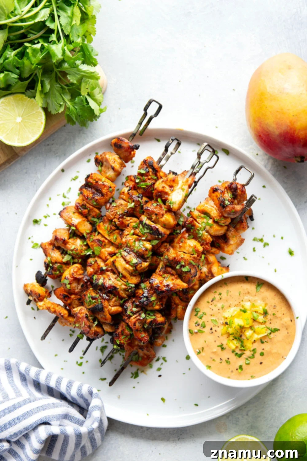 Mango Glazed Thai Chicken Skewers 3 Close-up of grilled Thai chicken skewers showing the juicy texture and aromatic marinade.