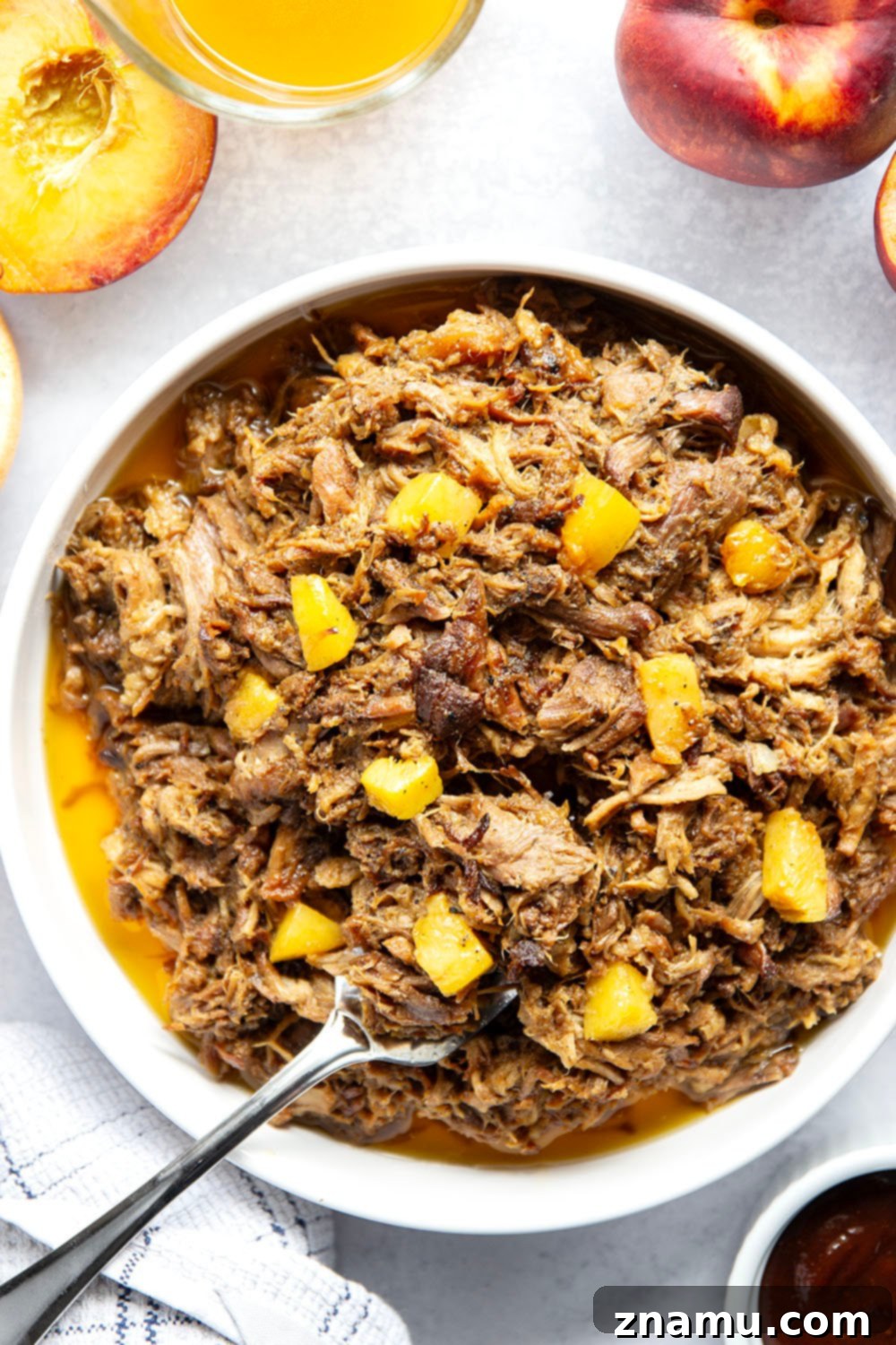Sweet Heat Peach Pulled Pork 5 Slowly braised in sweet peaches and spicy hot honey, this peach hot honey pulled pork is fall-apart tender and makes one incredible sandwich!
