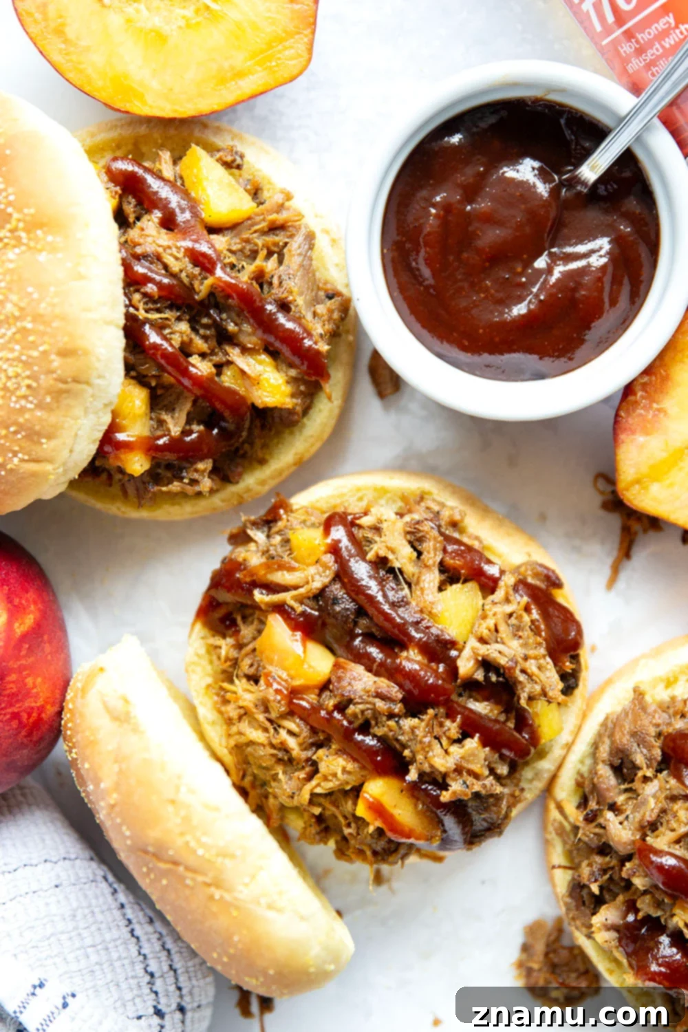 Sweet Heat Peach Pulled Pork 6 Slowly braised in sweet peaches and spicy hot honey, this peach hot honey pulled pork is fall-apart tender and makes one incredible sandwich!