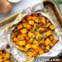 Tossed in a homemade honey mustard and grilled to tender, smoky perfection in foil packets, these grilled sweet potatoes in foil are an easy side dish to throw on the grill for any occasion.