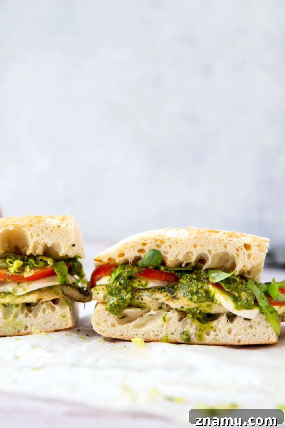 These sandwiches feature smoky pesto grilled chicken sandwiched between soft ciabatta bread with lots of fresh tomato and mozzarella.