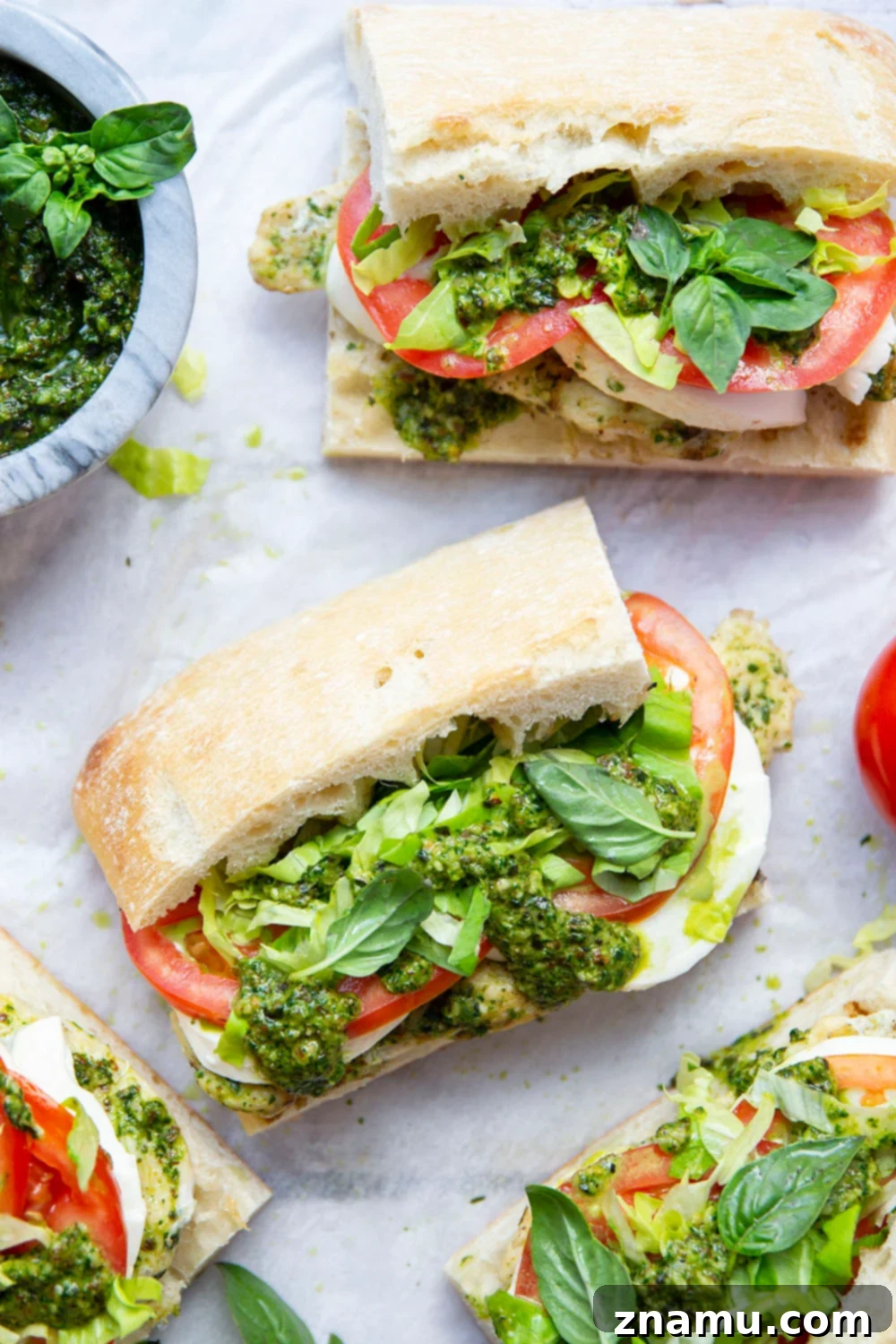 These sandwiches feature smoky pesto grilled chicken sandwiched between soft ciabatta bread with lots of fresh tomato and mozzarella.